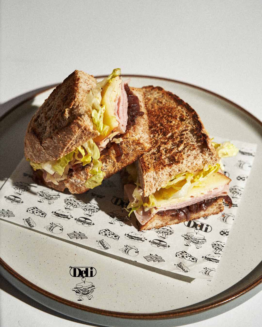 MELT IT logo over a toasted sandwich