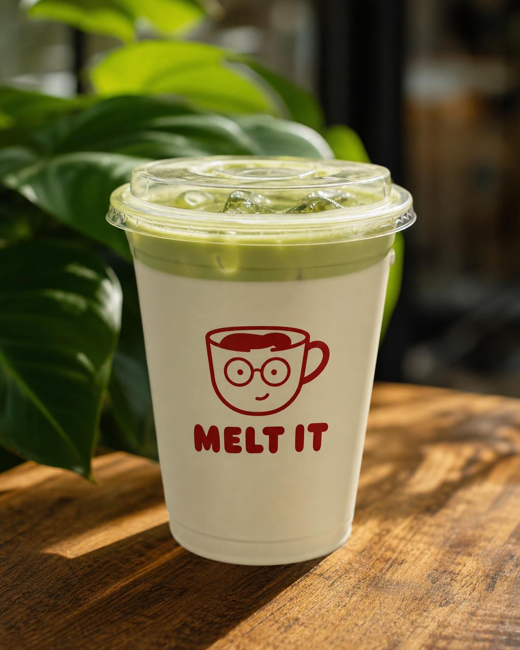 Iced matcha latte in tall glass