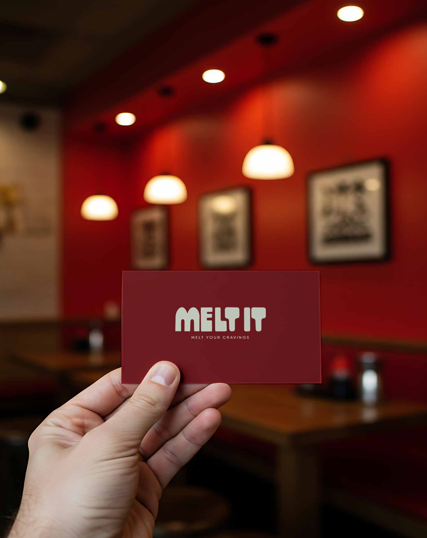 MELT IT bag on red tray at an outdoor café